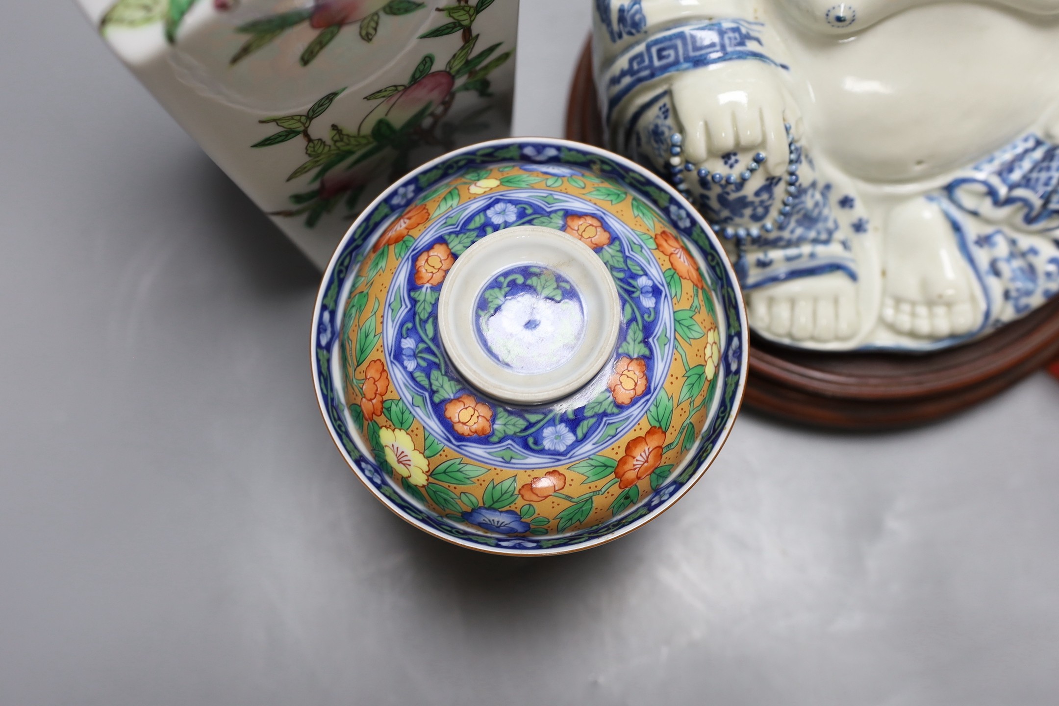 A Chinese peach vase, Buddha, two hardstone balls and a blanc de chine figure and a bowl and cover on stand, peach vase 32 cms high